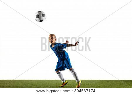 Young Boy As A Soccer Or Football Player In Sportwear Making A Feint Or A Kick With The Ball For A G