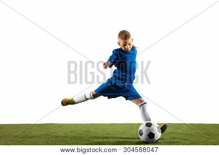 Young Boy As A Soccer Or Football Player In Sportwear Making A Feint Or A Kick With The Ball For A G