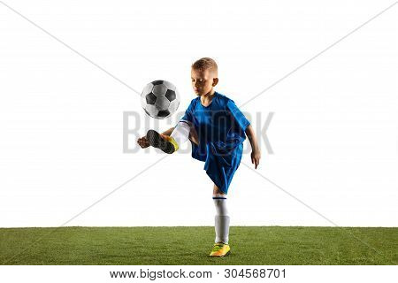 Young Boy As A Soccer Or Football Player In Sportwear Making A Feint Or A Kick With The Ball For A G