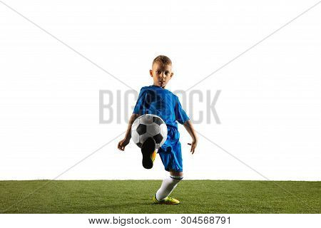 Young Boy As A Soccer Or Football Player In Sportwear Making A Feint Or A Kick With The Ball For A G