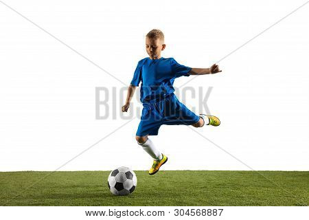 Young Boy As A Soccer Or Football Player In Sportwear Making A Feint Or A Kick With The Ball For A G