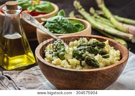 Asparagus And Spinach Risotto , Italian Cuisine., On Dark Background.