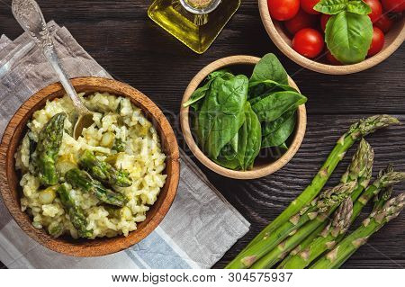 Asparagus And Spinach Risotto , Italian Cuisine, On Dark Background.