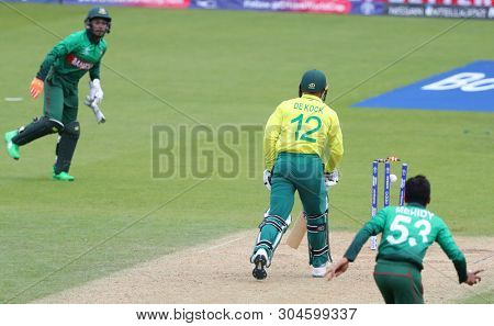 LONDON, ENGLAND. 02 JUNE 2019: Mushfiqur Rahim of Bangladesh runs out Quinton de Kock of South Africa  during the South Africa v Bangladesh, ICC Cricket World Cup match