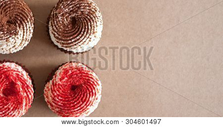 Chocolate Cupcakes With Cream Cheese Frosting, Decorated With Cocoa And Dried Strawberry Powder.