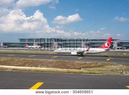 Istanbul, Turkey - 25 May 2019:  Turkish Airline Plane Taxi By Main Terminal Gates Of New Istanbul A