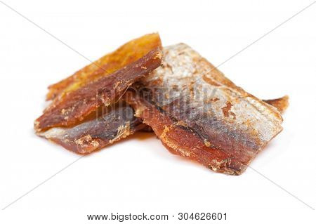 Pieces of cleaned dried fish isolated on white (Dry Peppered Pollack)