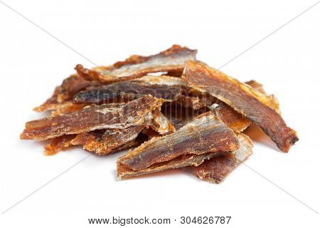 Pieces of cleaned dried fish isolated on white (Dry Peppered Pollack)