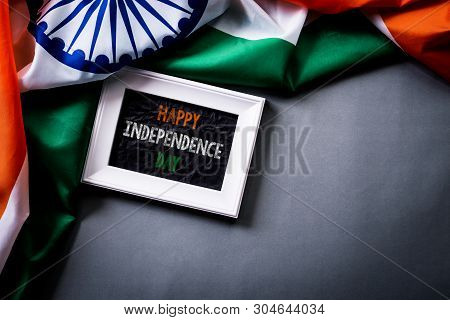 Top View Of Picture Frame With National Flag Of India On Gray Background. Indian Independence Day.