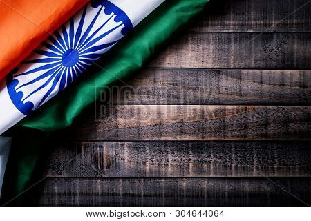 Top View Of National Flag Of India On Wooden Background. Indian Independence Day.
