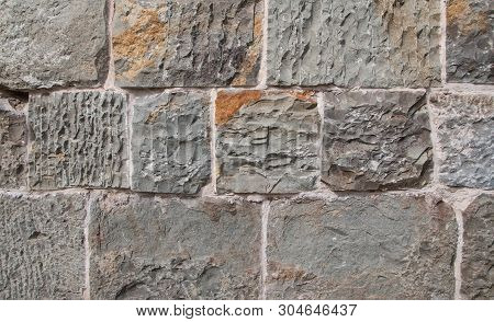 Grey And Brown Concrete Block Cobble Stone Texture Pattern Background. Close Up
