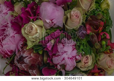 Beautiful Bouquet Of Mixed Flowers. The Work Of The Florist At A Flower Shop. Background On Full Scr