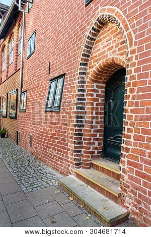 Pregnant House Or Das Schwangere Haus With Deformed Brick Wall In Luneburg. Germany