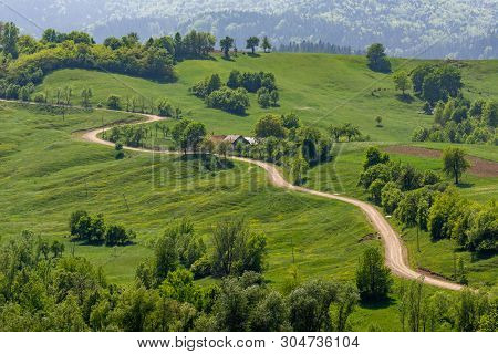 Beautiful Sinuous Road In Bucovina Rural Area, Romania