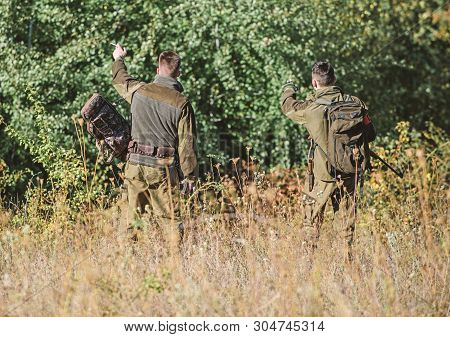 Man Hunters With Rifle Gun. Boot Camp. Hunting Skills And Weapon Equipment. How Turn Hunting Into Ho