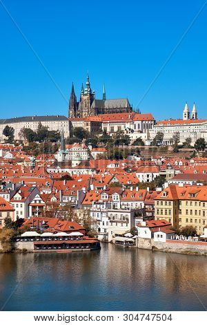 Historical Prague, St. Vitus Cathedral And Other Historical Buildings Reflected In The River
