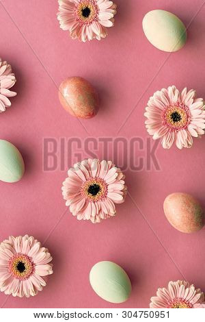 Geometrid Diagonal Easter Flat Lay In Coral Color With Painted Eggs And Gerbera Daisy Flowers