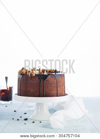 Easy Birthday Drip Cake With Melted Chocolate Ganache With Party Decor On A White Background. Copy S