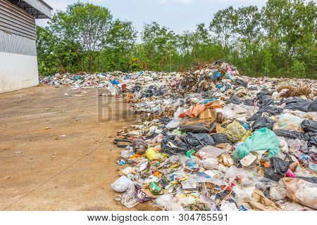 Garbage Dump Pile In Trash Dump Or Landfill,truck Is Dumping The Gabage From Municipal,pollution Con