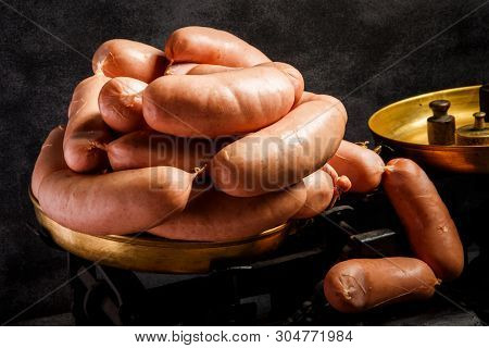 Big Bunch Of Raw Short Thick Wieners Rolled In Spiral On Scales