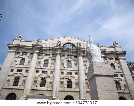 Milan, Italy - May 25, 2019: Mezzanotte Palace Facade And Middle Finger Sculpture In Milan Stock Exc