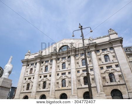 Milan, Italy - May 25, 2019: Mezzanotte Palace Facade And Middle Finger Sculpture In Milan Stock Exc