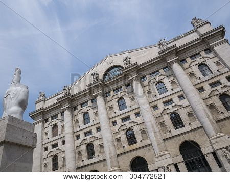 Milan, Italy - May 25, 2019: Mezzanotte Palace Facade And Middle Finger Sculpture In Milan Stock Exc