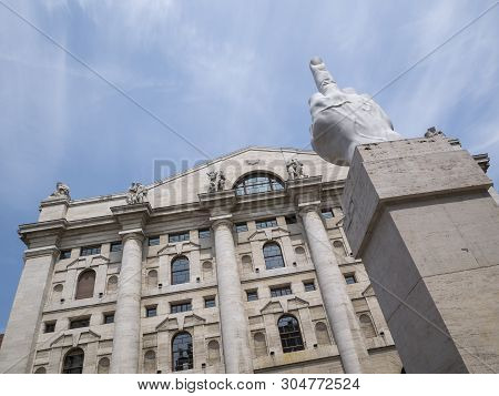 Milan, Italy - May 25, 2019: Mezzanotte Palace Facade And Middle Finger Sculpture In Milan Stock Exc