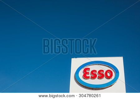 Lyon, France - February 26, 2019: Esso Logo On Its Gas Service Station In Lyon, France On Blue Sky B