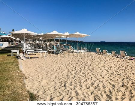 Nikiti Beach Is In The Village Of Nikiti With Sun Beds And Umbrellas, Sithonia Peninsula, Chalkidiki