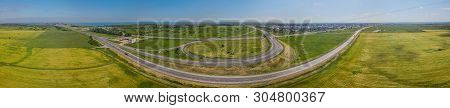 Aerial Panoramic View Of Transportation Highway Overpass, Ringway, Roundabout, Urban Traffic