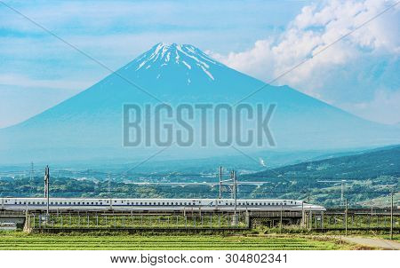 2017 May 31. Shizuoka Japan. Running High Speed Train Tokaido Shinkansen And Fuji Mountain With Rice