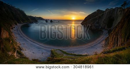 Panorama Of Playa Del Silencio Rocky Coast With Cliffs In Background At Sunset, Asturias, Spain