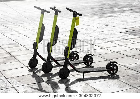 Few Electric Scooters Parked Waiting For Someone To Pick Them