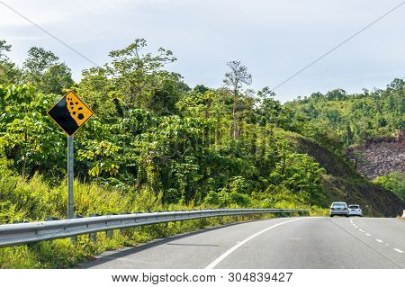 Falling Mountain Rocks/ Rock Slide Symbol Road Warning Street Sign/signage On Dual Carriageway Highw