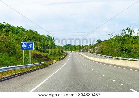 Toll Plaza Ahead Street Sign/signage On Dual Carriageway Highway Where Vehicles Drive On Left Hand S