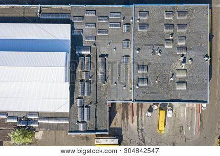 Bus Station Garage Building With Grey Flat Roofing. Birds Eye View