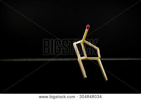 Concept Of Solitude Or Contemplation, Social Isolation. Picture Of A Man Holding Matchpost Sitting I