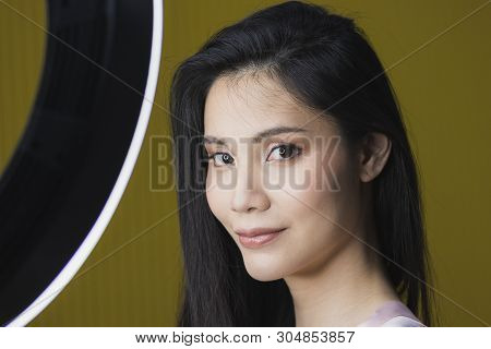 Beautiful Asian Woman Model  Take A Selfie Photo In Front Of Studio Light.