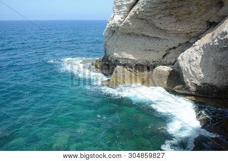 Rosh Ha Nikra. Israel. Sea Waves And White Rock. A Unique Tourist Attraction Located On The North-we