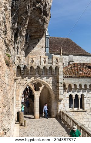 Rocamadour, France - September 3, 2018: Stone Walls Of Historic Basilica Of St-sauveur Blend Into Th