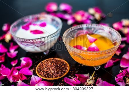Milk Face Pack For Clear Complexion On Shiny Black Wooden Surface I.e. Raw Milk Well Mixed With Sand