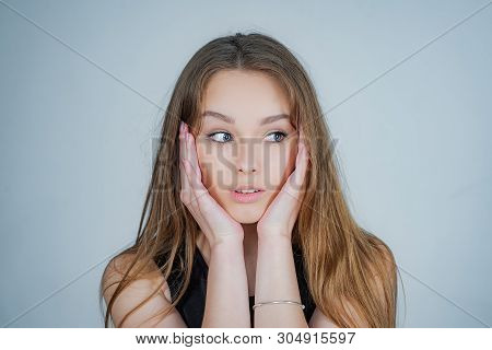Curious Cheerful Woman With Blonde Hair Wearning Stylish Casual. Girl Is Always Happy To Hear Intere