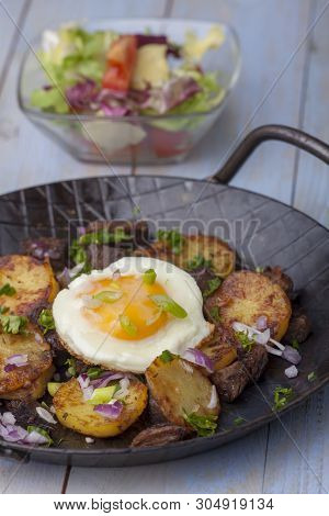 Sunny Side Up Egg On Groestl On Wood
