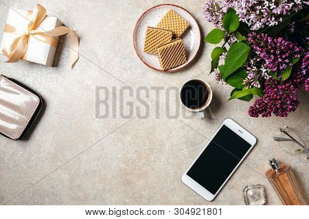 Top View Home Office Desk Workspace. Flat Lay Wallet, Gift Box, Coffee Cup, Smartphone, Perfume Bott