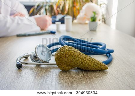Concept Photo Of Diagnosis And Treatment Of Thyroid. In Foreground Is Model Of Thyroid Gland Near St