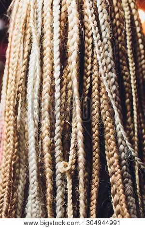 Texture Of Thin Brown Pigtails, Afro Style.