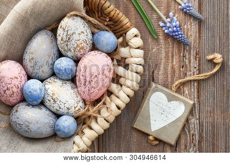 Easter Background With Eggs, Blue Hyacinth Flowers And  Wooden Heart, Top View On Rustic Wood