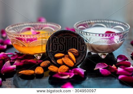 Milk And Almond Face Pack On Black Colored Shiny Surface I.e. Raw Milk,almond,honey Well Mixed In A