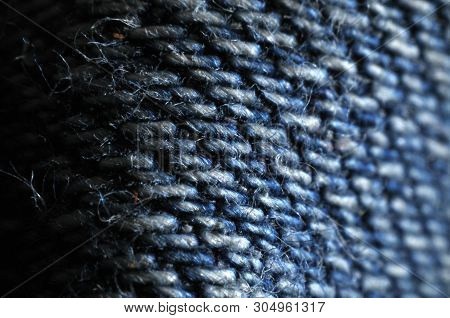 Macro-photography Of Woven Denim, A Sort Of Twill Weaving At Old Blue Jeans